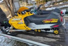 2001 Skidoo MXZ, 1996 Arctic Cat JAG, and trailer